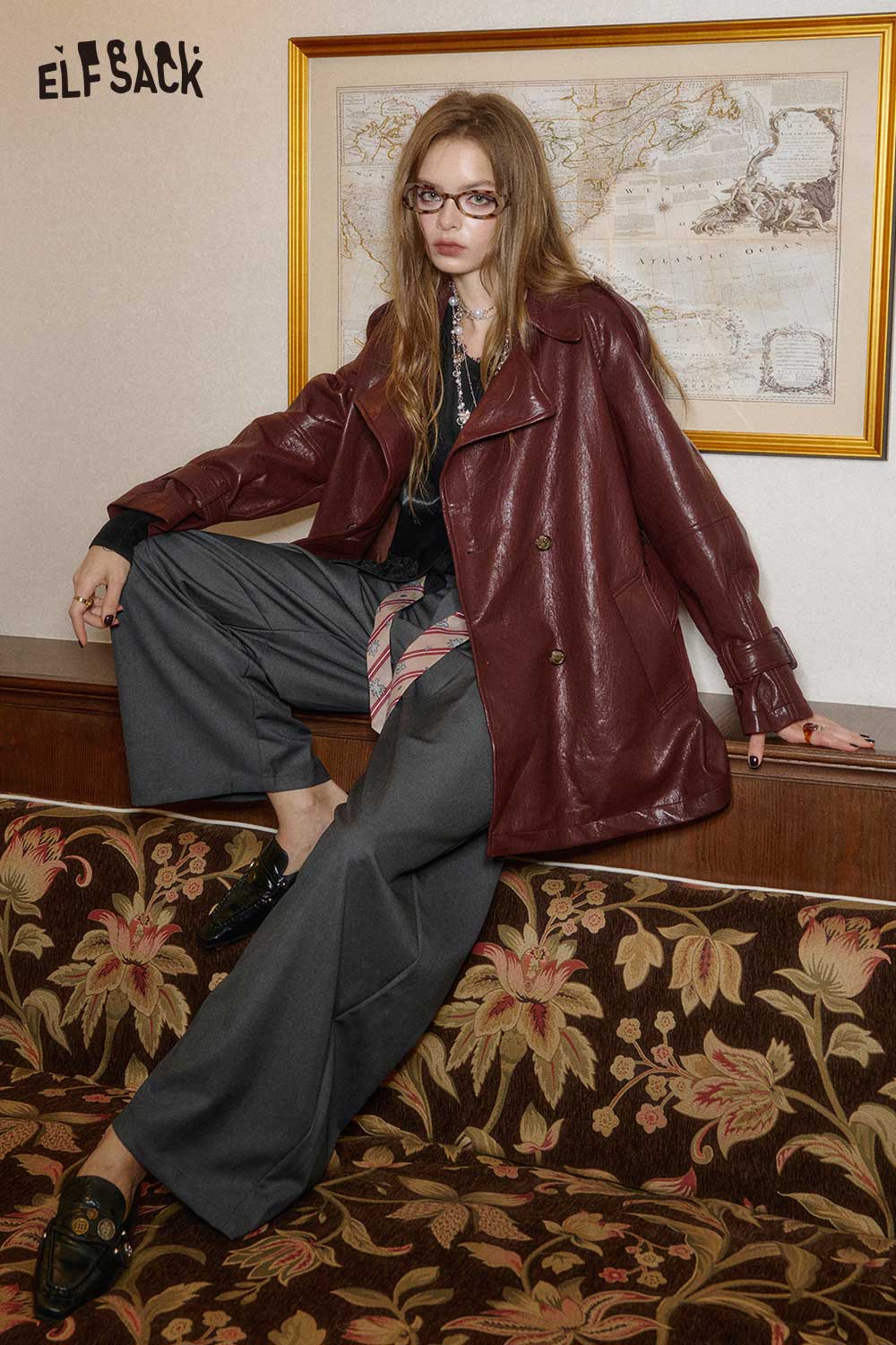 ELFSACK matte black PU leather sleeveless top styled with oversized maroon jacket and wide-leg pants