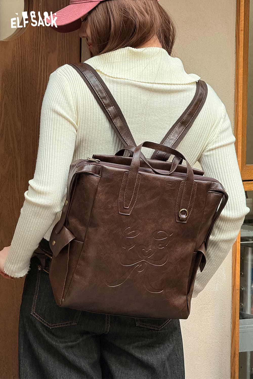 Stylish ELFSACK minimalist brown backpack for women with adjustable straps and textured finish