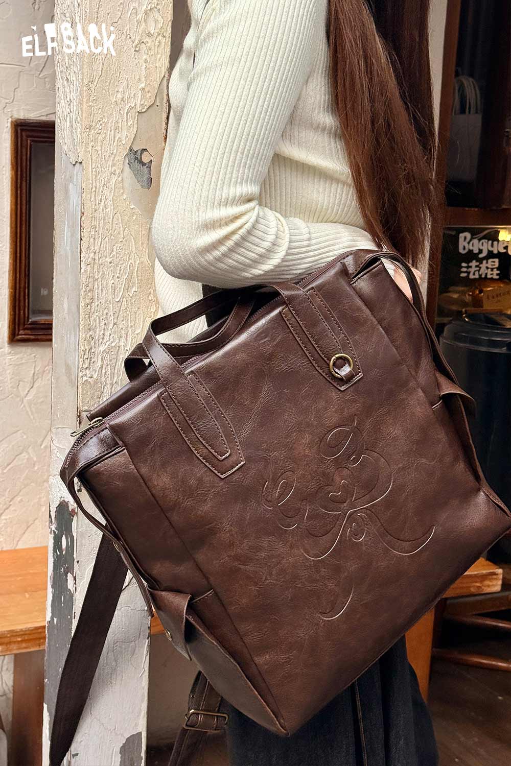ELFSACK minimalist brown backpack for women with stylish embossed design and dual handles