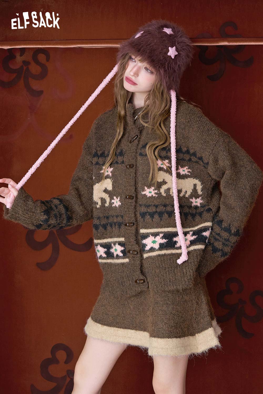 ELFSACK minimalist Christmas stripe dress paired with a cozy cardigan and whimsical hat for a festive look