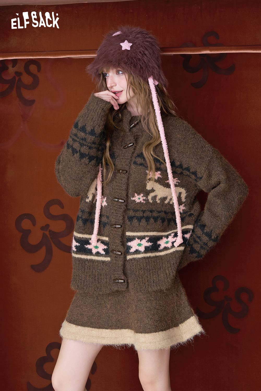 ELFSACK cozy cardigan over a minimalist Christmas stripe dress perfect for holiday festivities