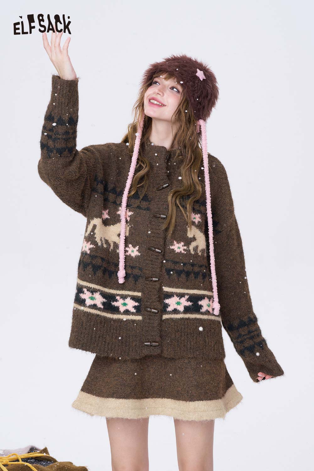 ELFSACK cozy cardigan with festive patterns styled with a minimalist Christmas stripe dress