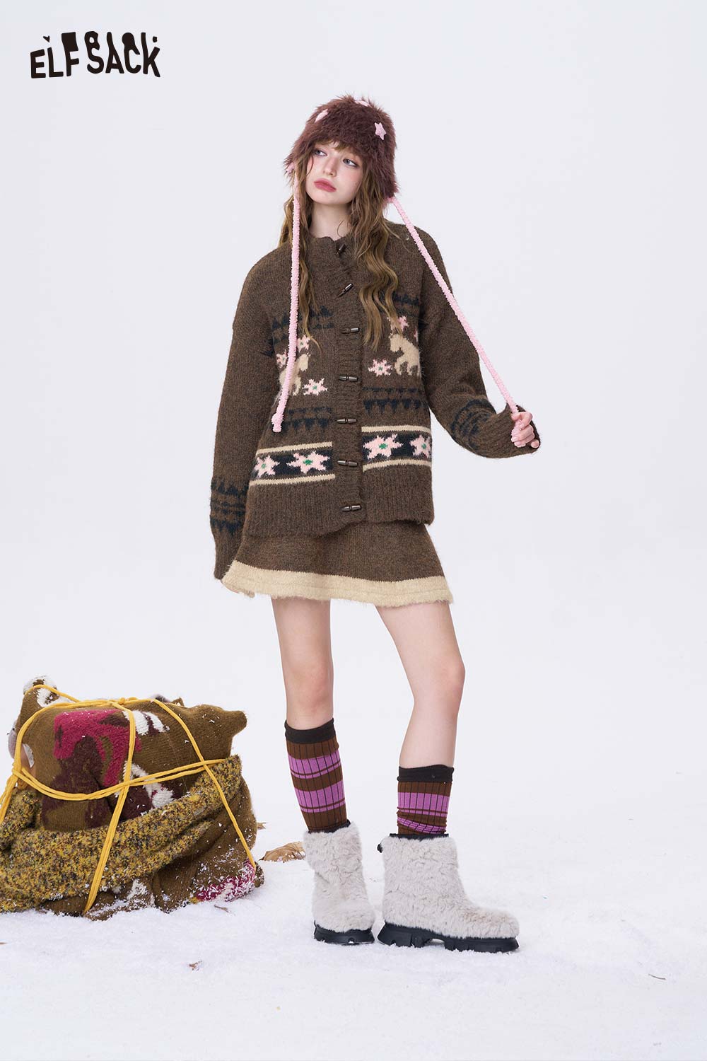 ELFSACK minimalist Christmas stripe dress styled with a cozy brown cardigan and winter accessories