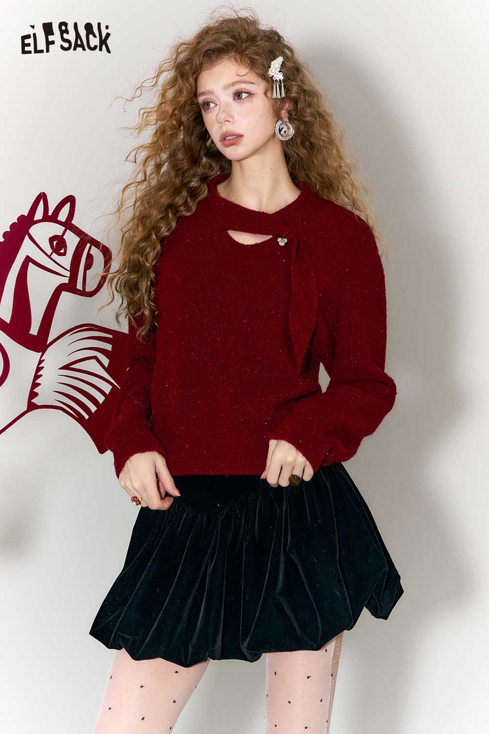 ELFSACK minimalist cropped sparkle sweater in burgundy, styled with a pleated black skirt