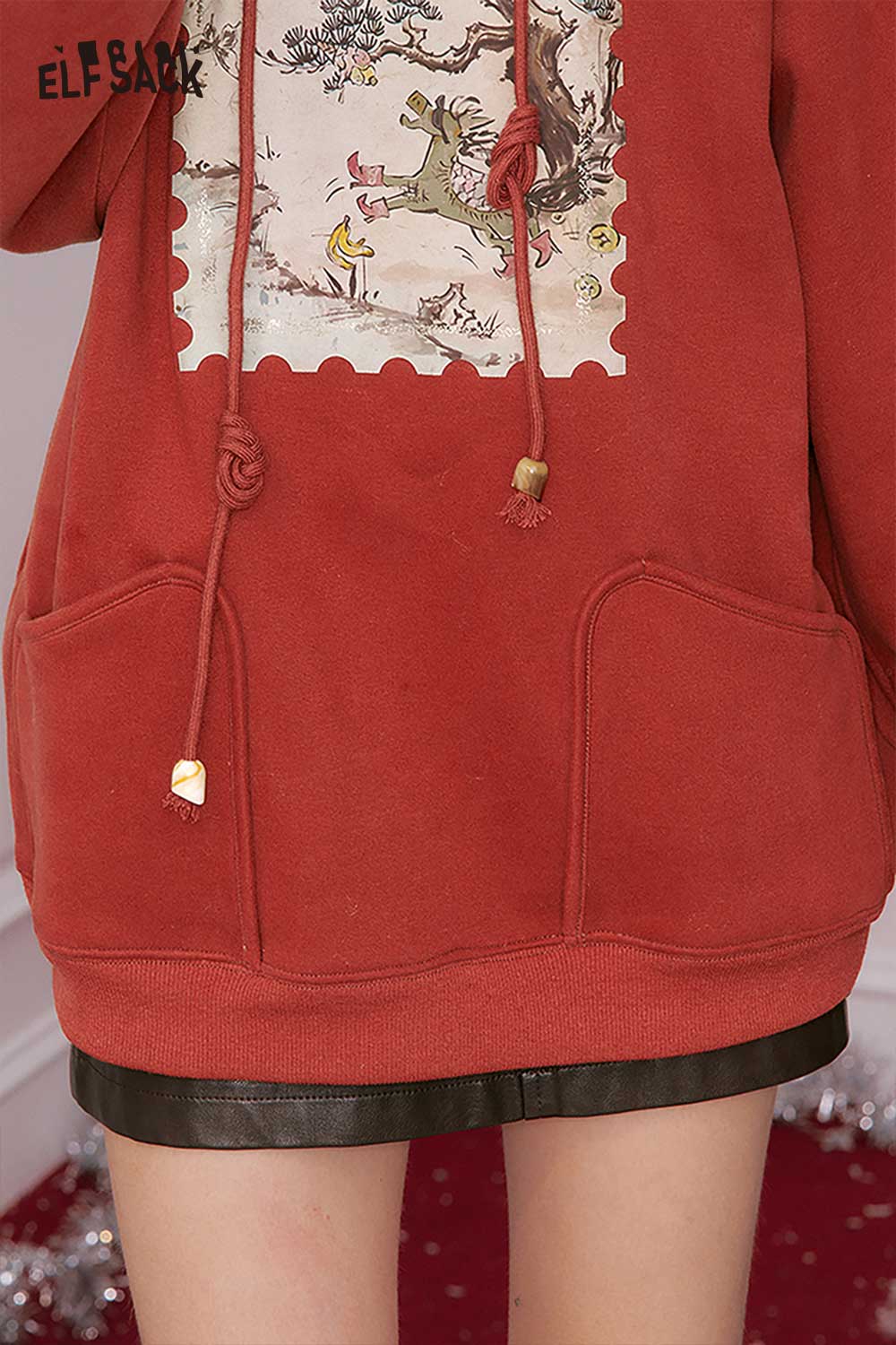 ELFSACK minimalist graphic hooded sweatshirt in red with unique design and front pockets
