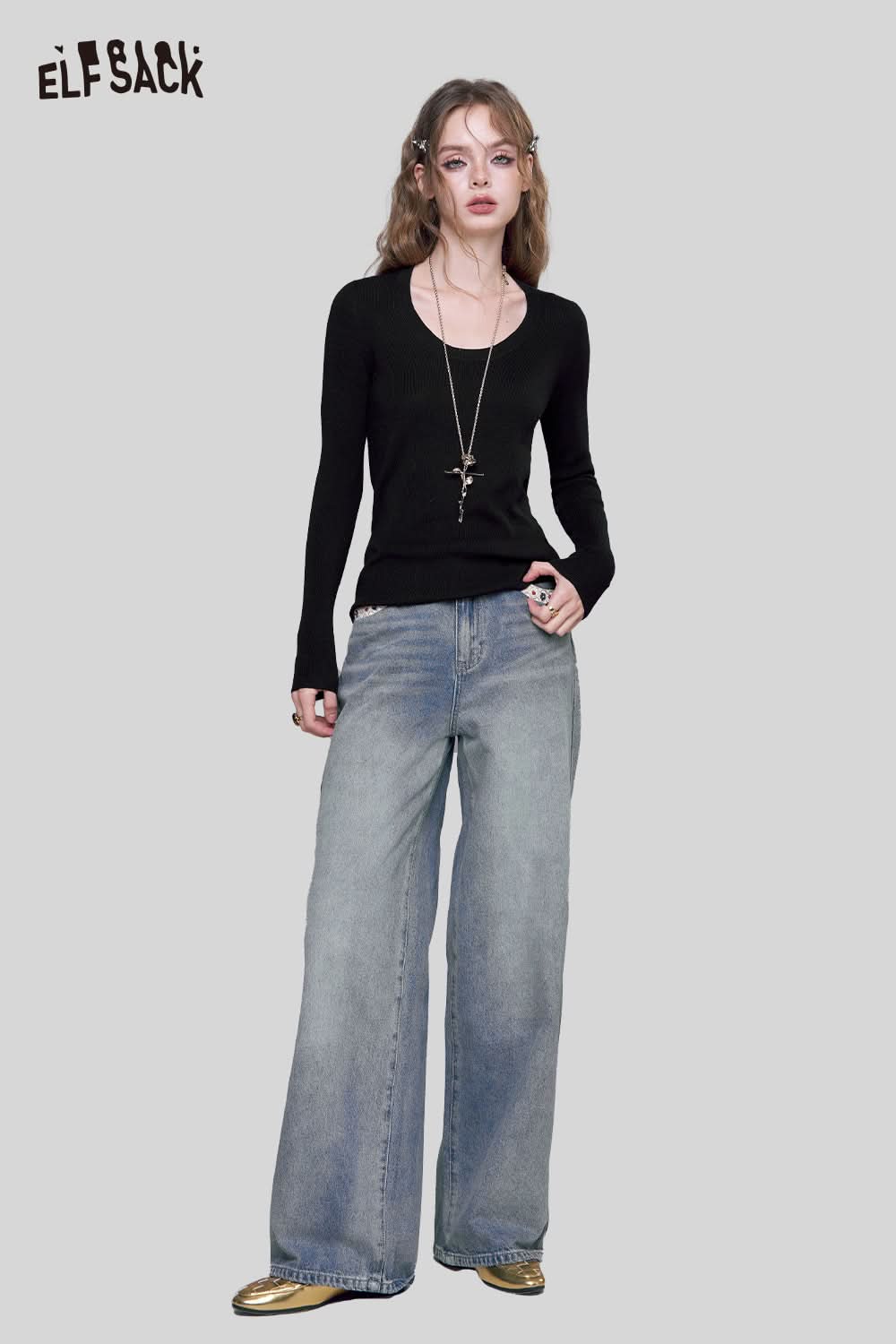 ELFSACK minimalist knit pullover for women in black, paired with wide-leg jeans for a chic look