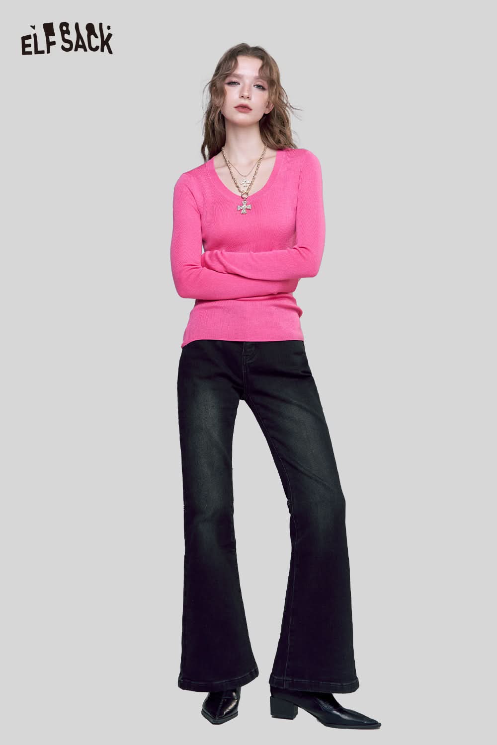 ELFSACK minimalist knit pullover for women in vibrant pink paired with flared black jeans