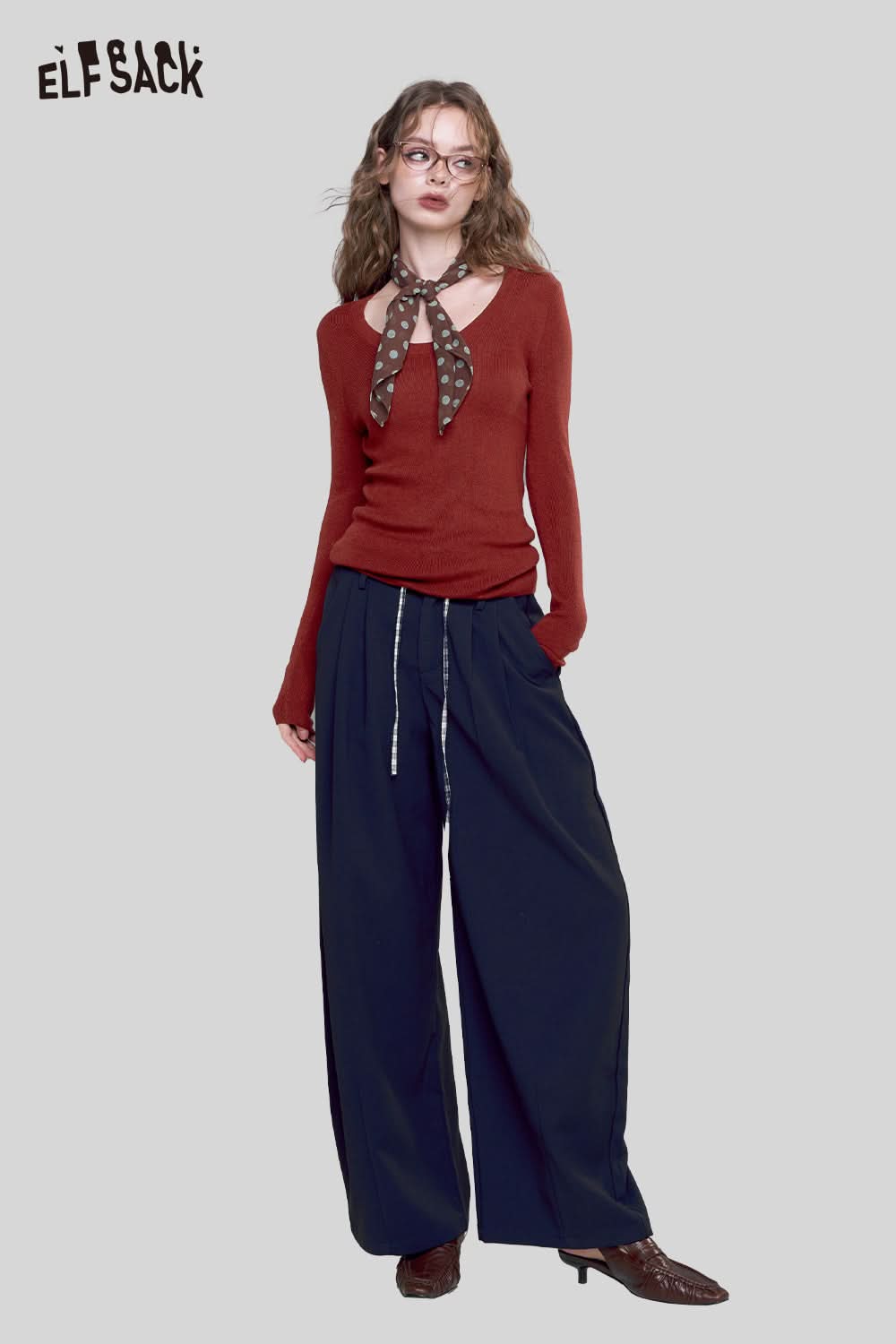 ELFSACK minimalist knit pullover for women in rust color, styled with wide-leg pants and a chic scarf