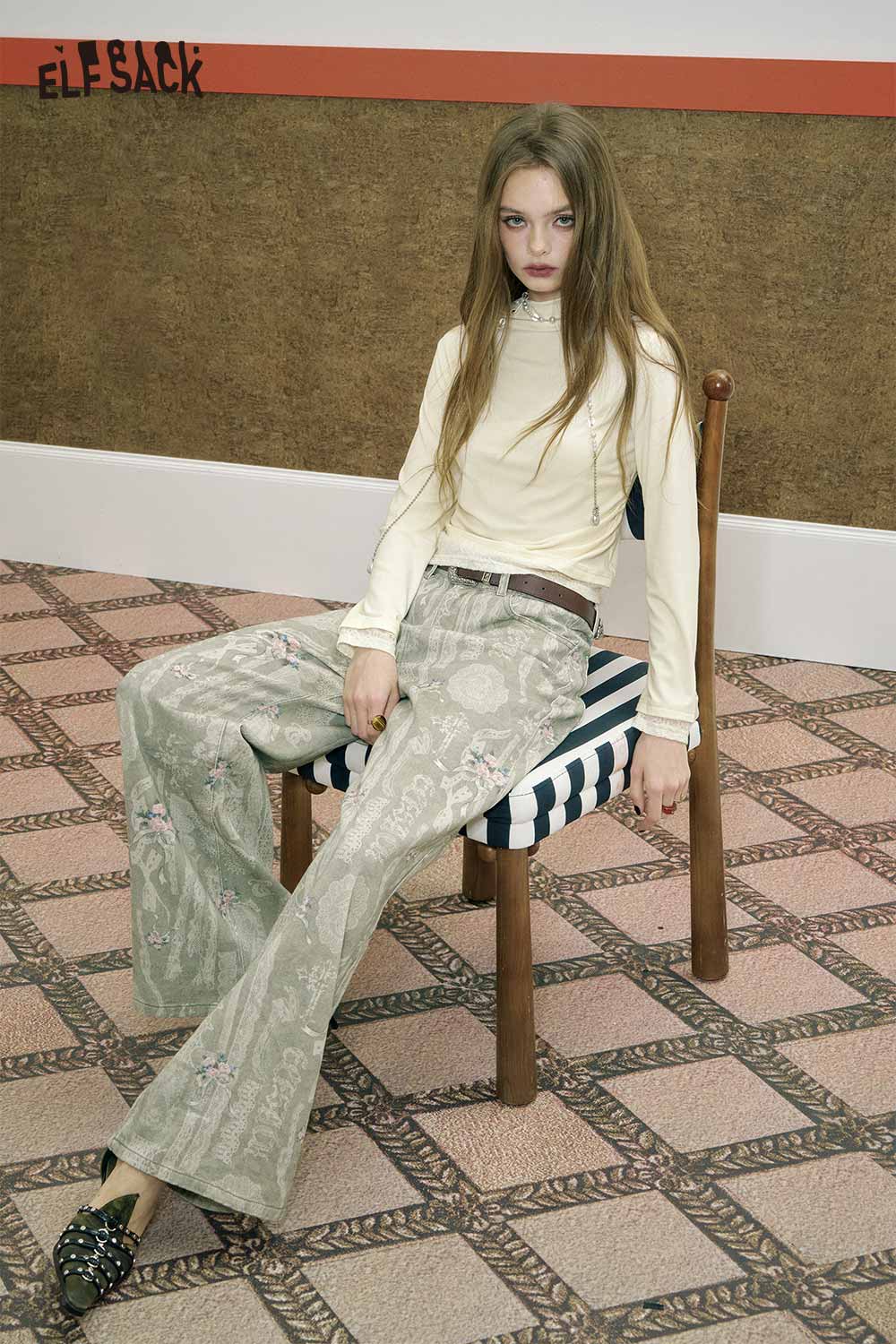 ELFSACK minimalist lace panel long sleeve tee in soft fabric, styled with patterned wide-leg pants