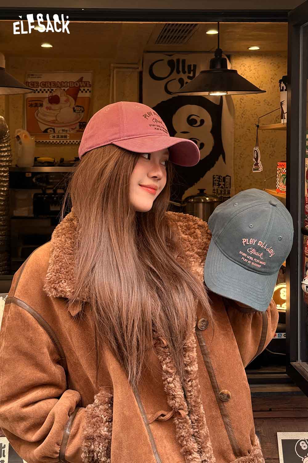 
                  
                    ELFSACK minimalist letter embroidered baseball cap in pink and green styles showcased by a model
                  
                