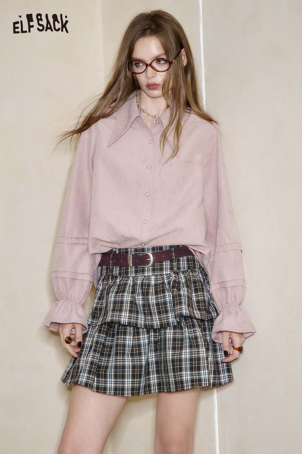 ELFSACK Women's minimalist peplum blouse in soft pink paired with a plaid skirt for a stylish look