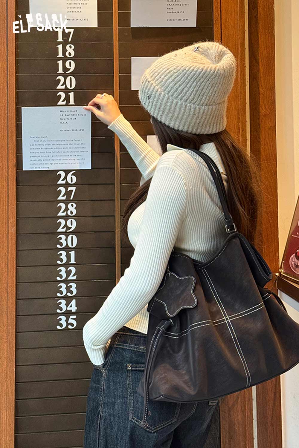 ELFSACK minimalist PU leather shoulder bag styled with a casual outfit and winter beanie