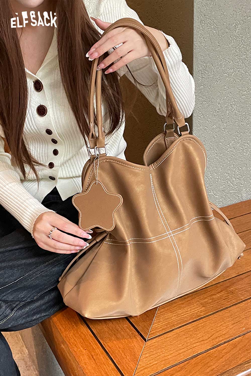 ELFSACK minimalist PU leather shoulder bag in tan with star-shaped charm and long straps