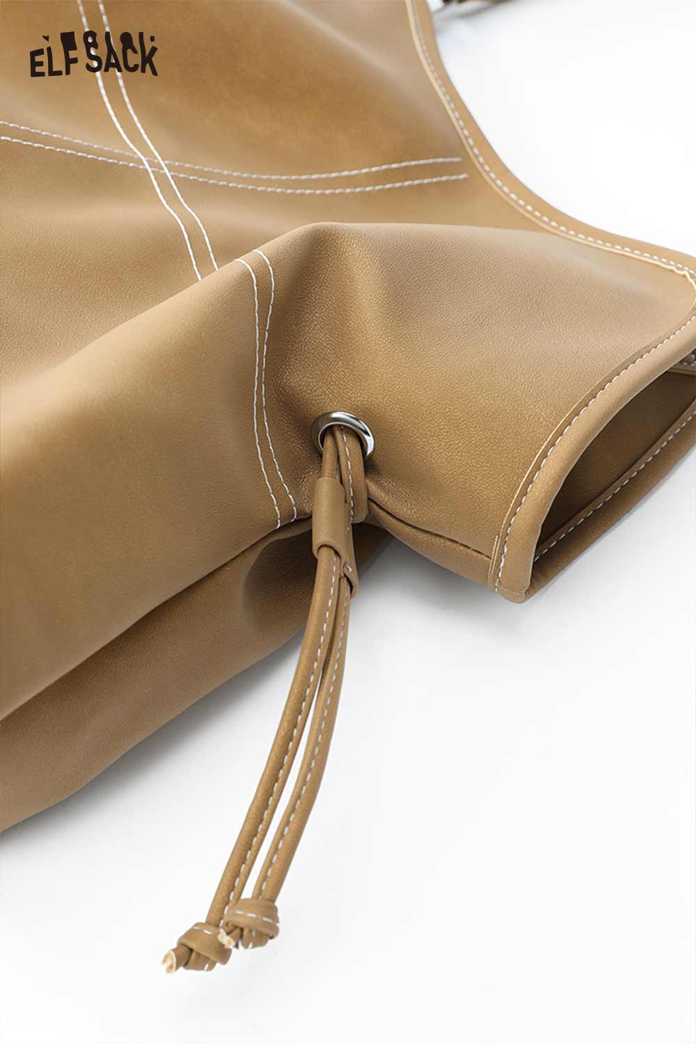 Close-up of ELFSACK minimalist PU leather shoulder bag featuring smooth texture and stylish stitching details
