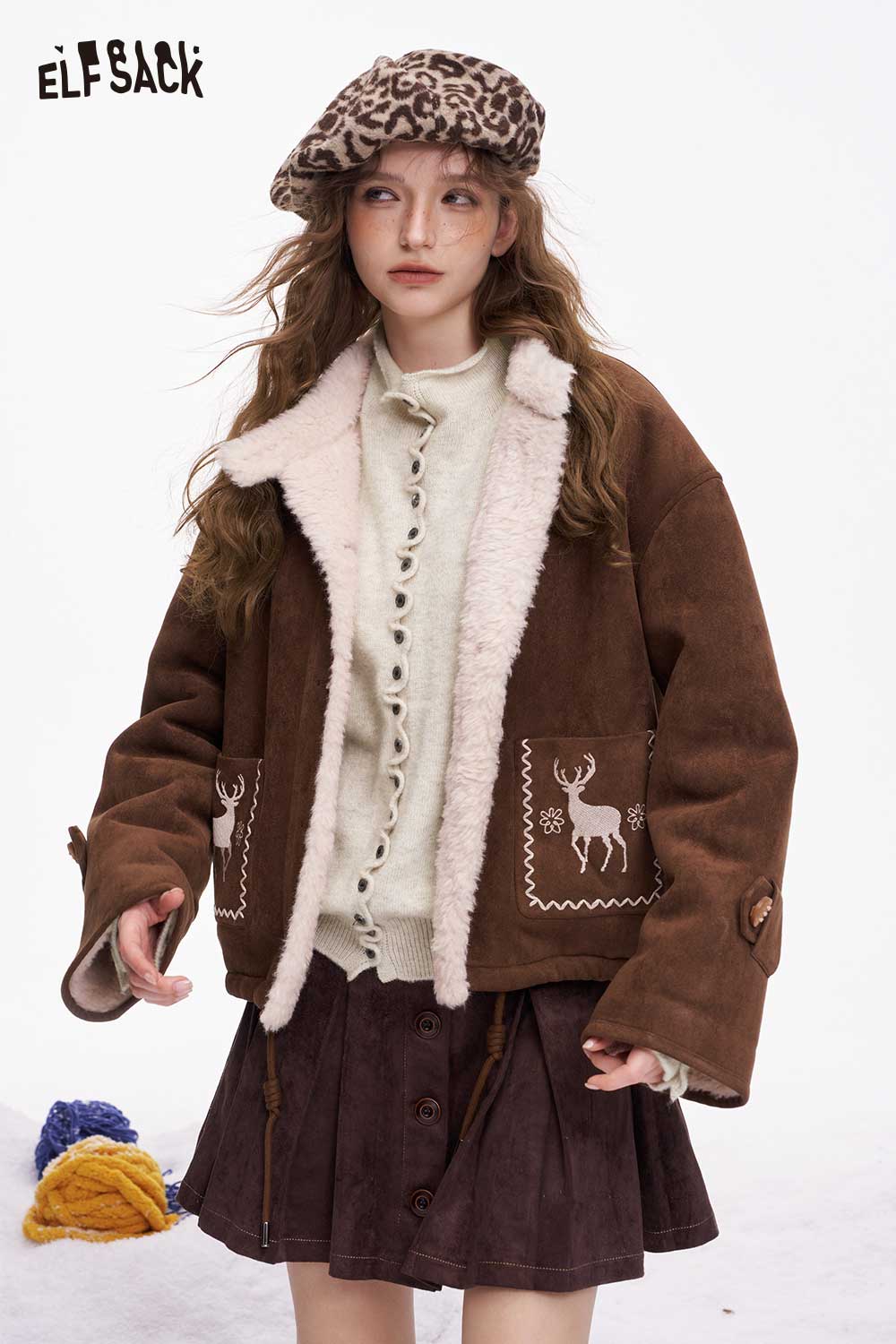 ELFSACK minimalist ruffle button knitwear styled under a cozy brown jacket for a chic look