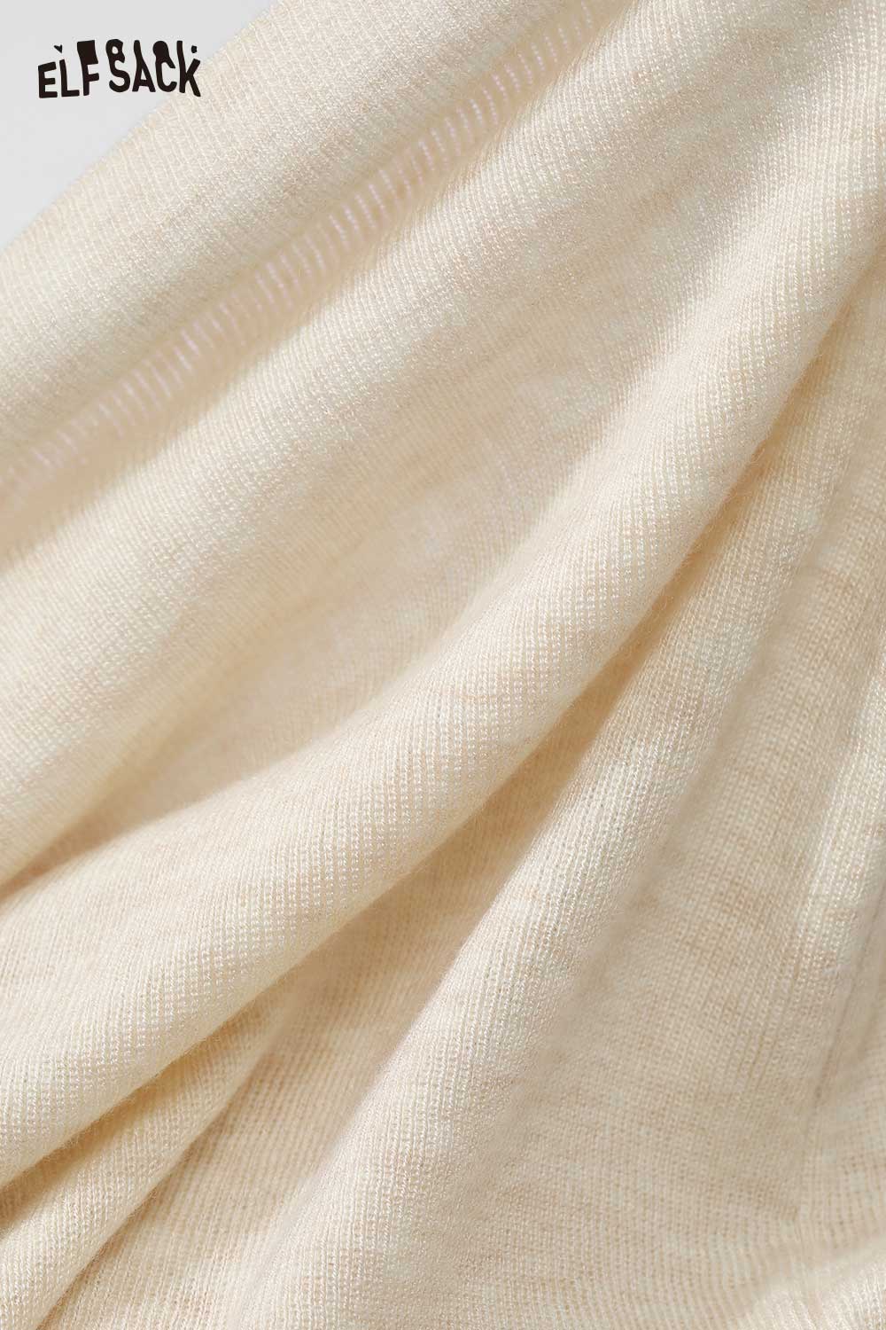 Soft beige ELFSACK knitwear featuring a minimalist slim fit top for women for a stylish look