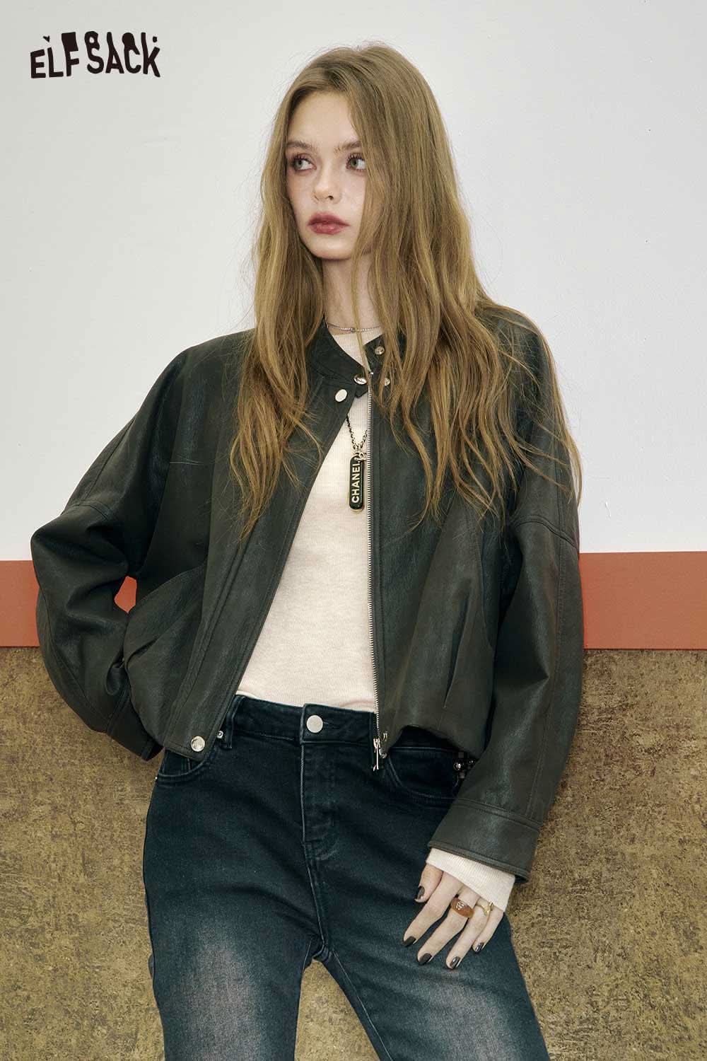 ELFSACK minimalist slim fit top for women modeled with a leather jacket and jeans for a stylish look