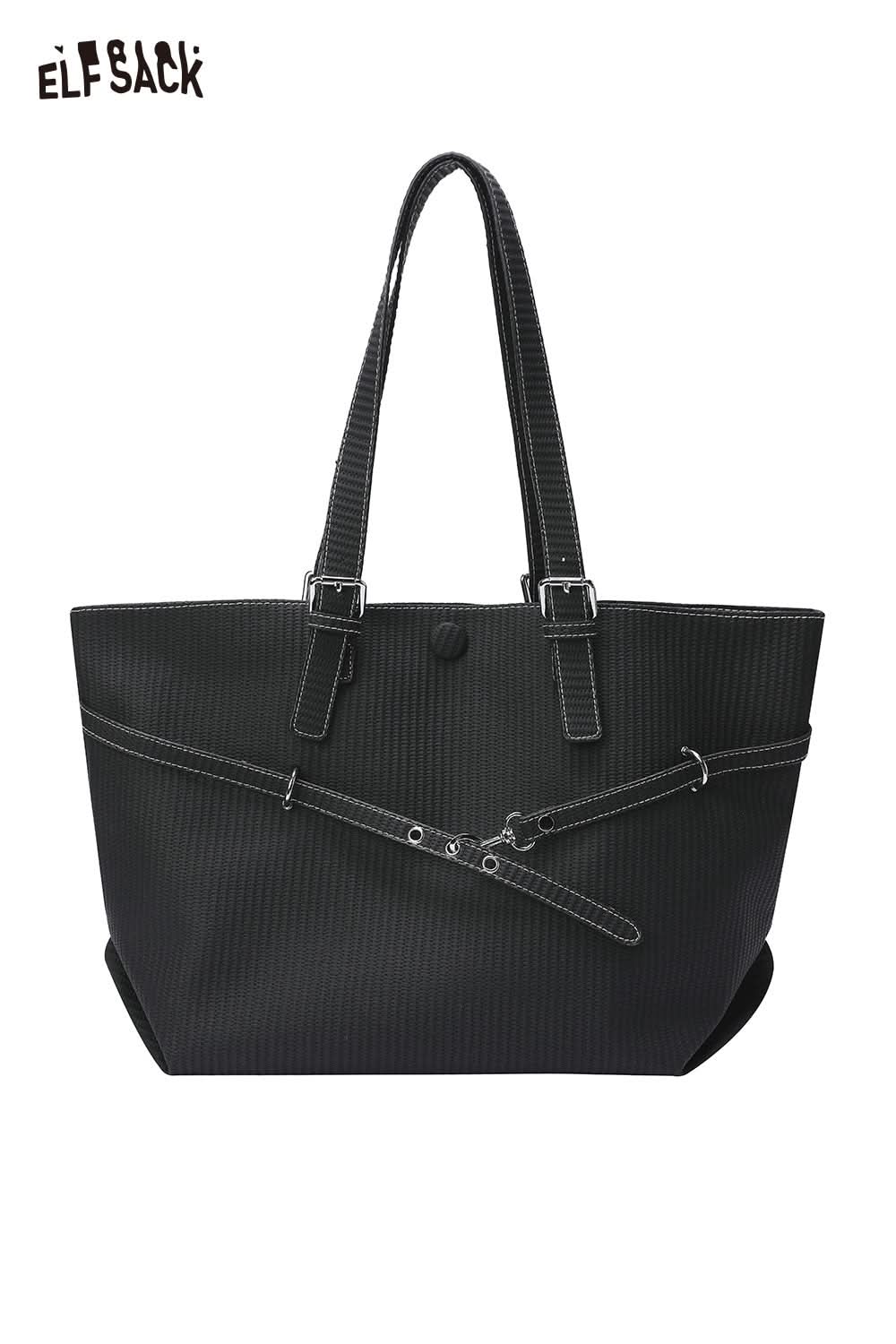 Black ribbed minimalist tote bag for women with adjustable straps and a sleek design