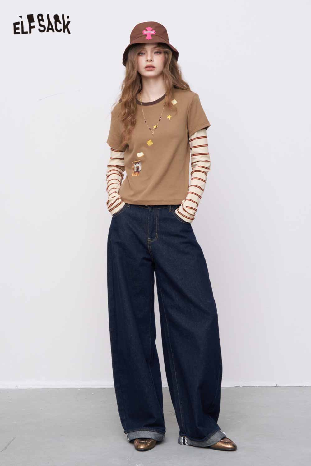 ELFSACK woman wearing slim fit stripe patchwork top brown layered over striped long sleeves paired with wide leg jeans