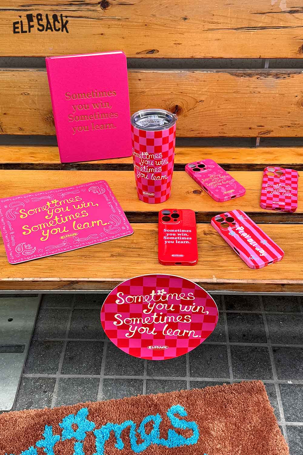 ELFSACK motivational quote hardcover notebook with matching accessories and bold design on a bench