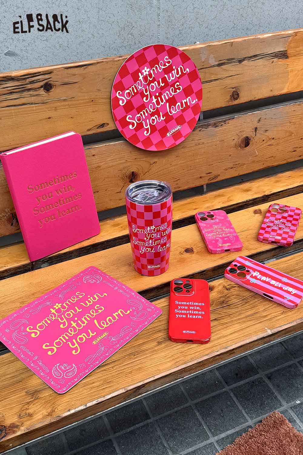 ELFSACK motivational quote hardcover notebook with matching accessories on a wooden bench