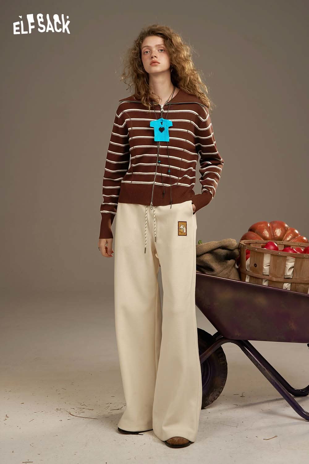ELFSACK navy collar striped knitted cardigan styled with wide beige pants for a cozy look