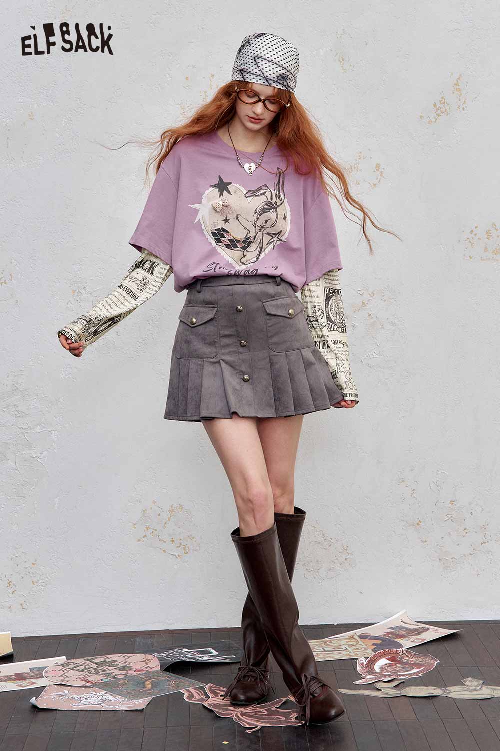 ELFSACK newsprint graphic drop shoulder tee in lavender paired with a stylish gray skirt