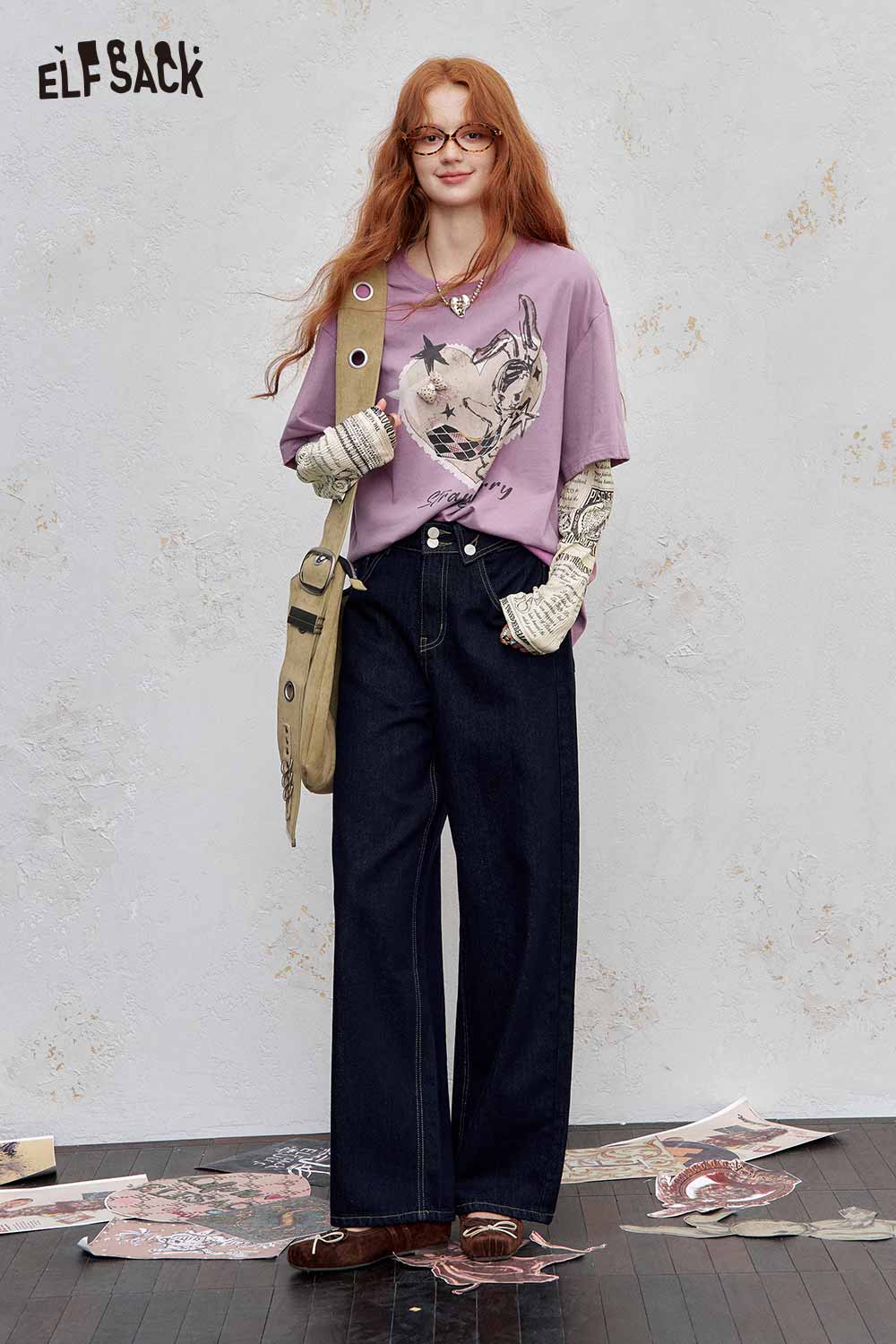 ELFSACK newsprint graphic drop shoulder tee in lavender paired with wide-leg jeans for a trendy look