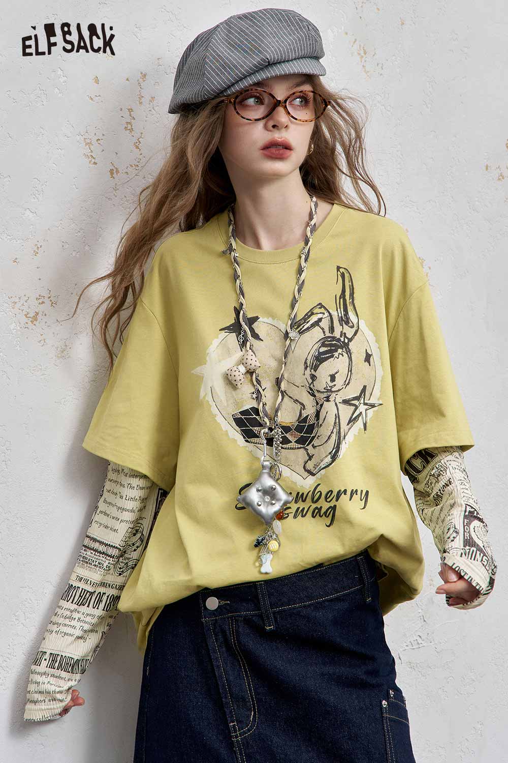 ELFSACK newsprint graphic drop shoulder tee in yellow with playful bunny design and oversized fit