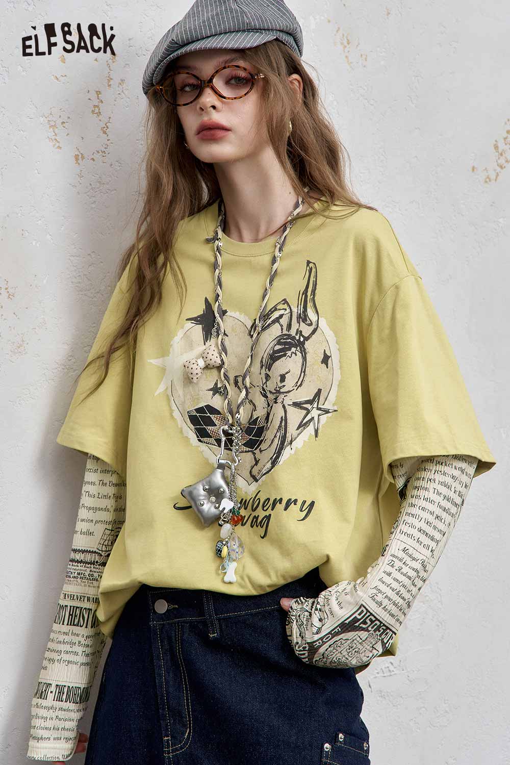 ELFSACK newsprint graphic drop shoulder tee in yellow with playful design and relaxed fit
