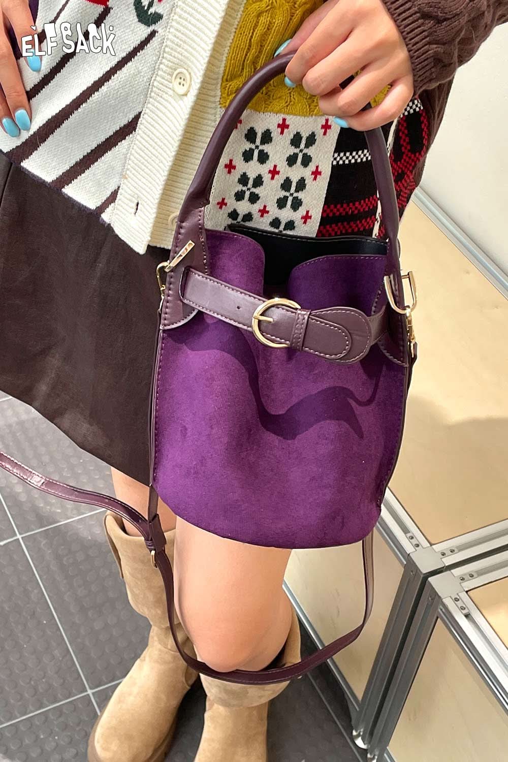 Purple nubuck leather crossbody bag with a stylish design and adjustable strap for everyday use