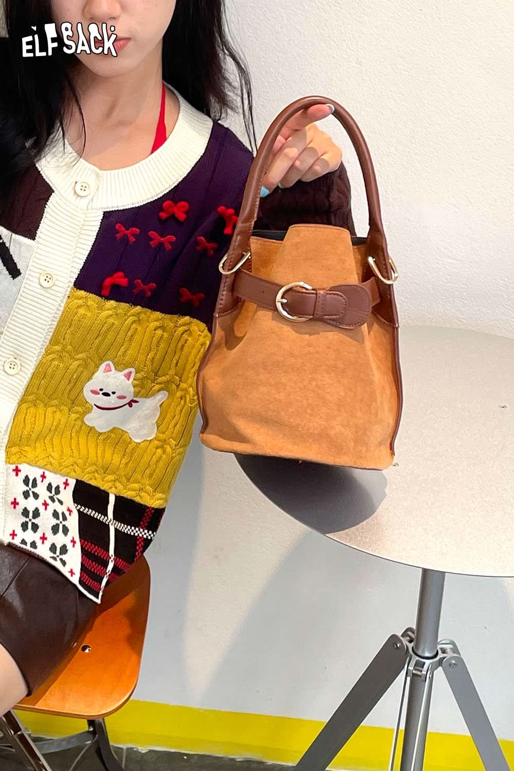 Stylish ELFSACK nubuck leather crossbody bag with a chic design and comfortable handle