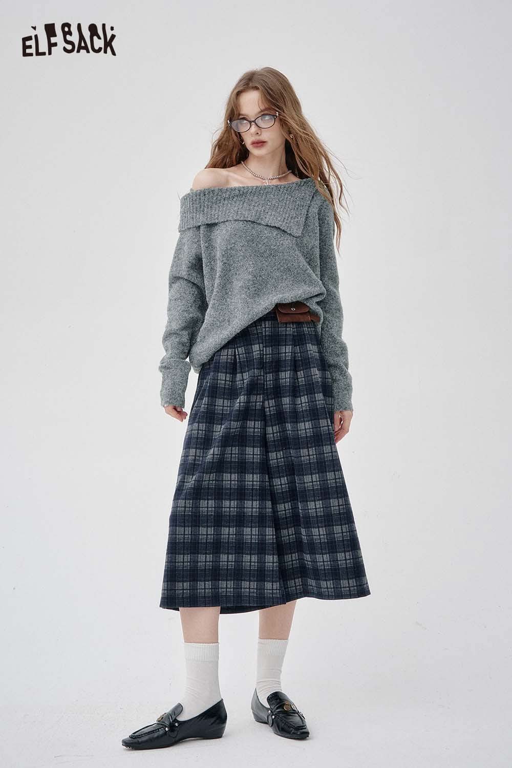 Gray off shoulder knit sweater for women paired with a plaid skirt for a trendy look