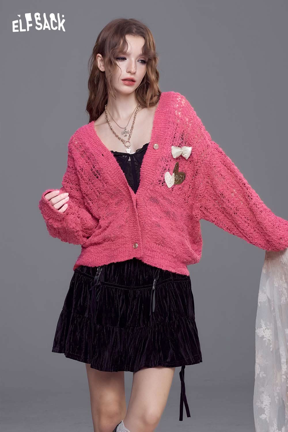 ELFSACK open knit cardigan with bows in pink, featuring a loose fit and stylish design