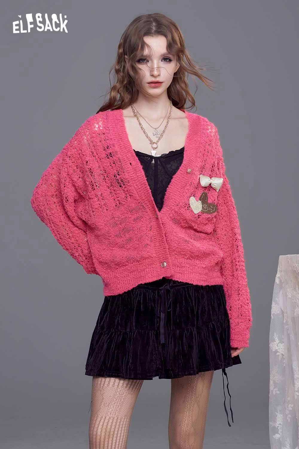 ELFSACK open knit cardigan with bows in pink featuring a decorative pocket for a stylish look