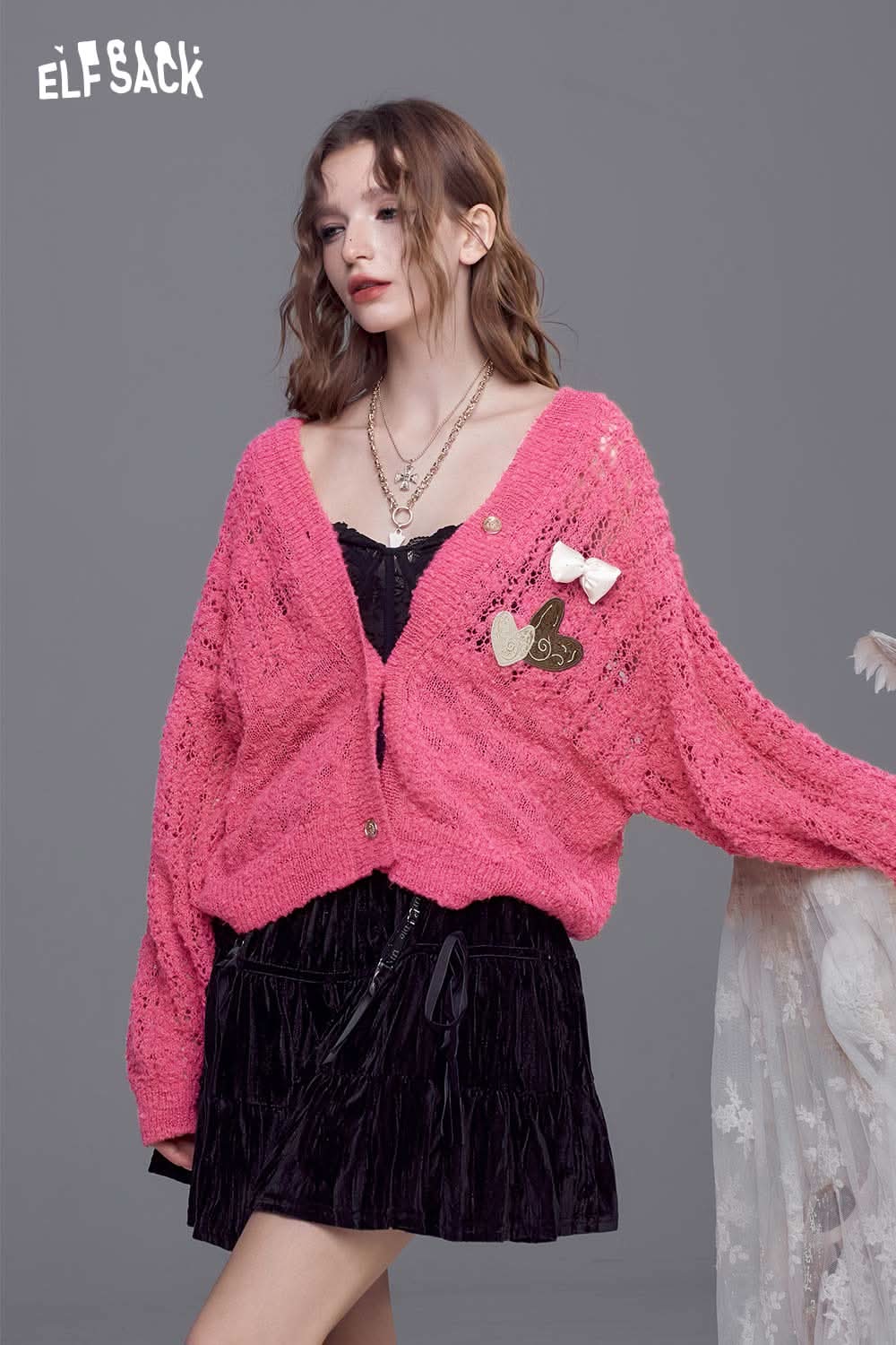 ELFSACK open knit cardigan with bows in pink, featuring a loose fit and decorative details for a stylish look