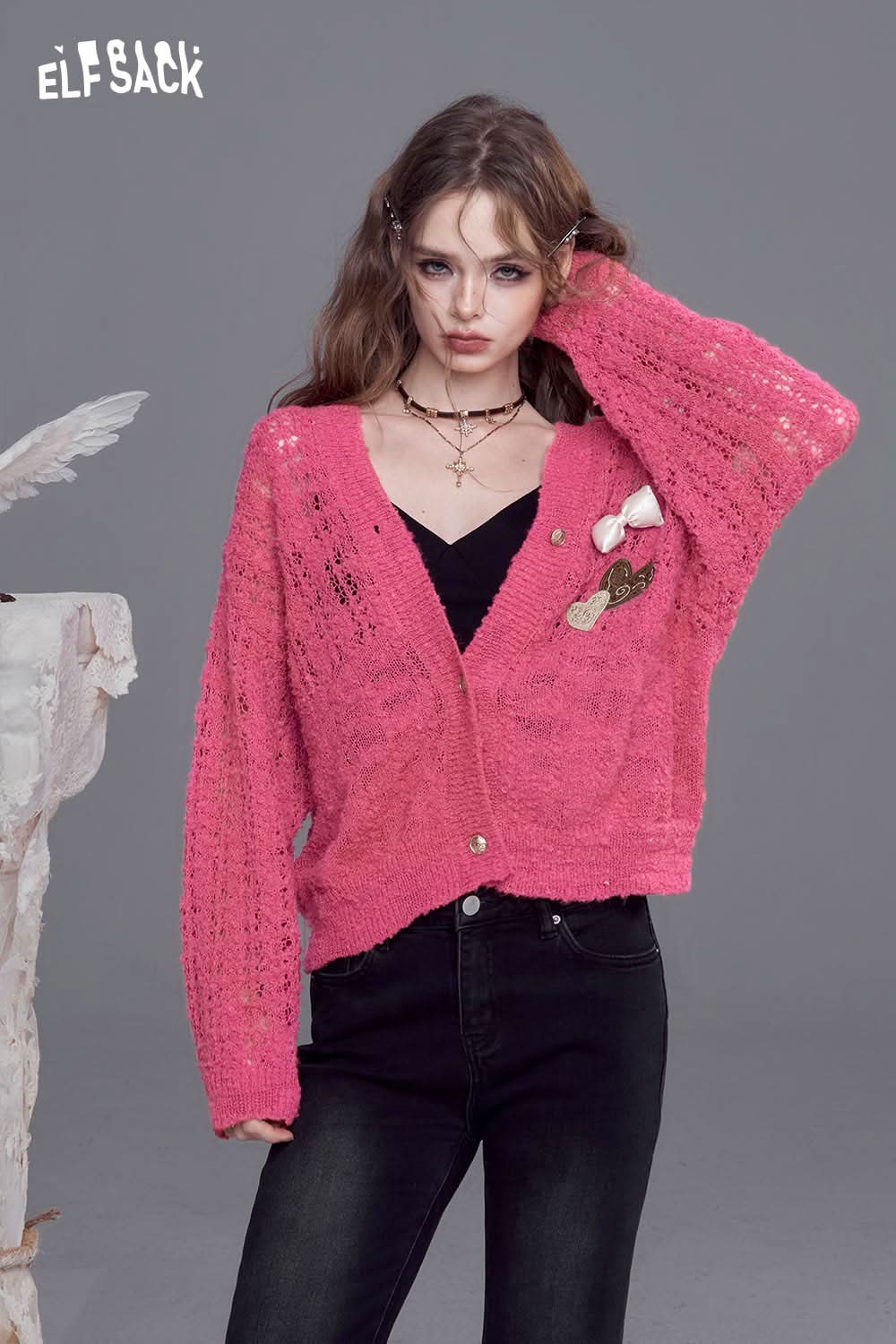 ELFSACK open knit cardigan with bows in vibrant pink, featuring a stylish loose fit and decorative details