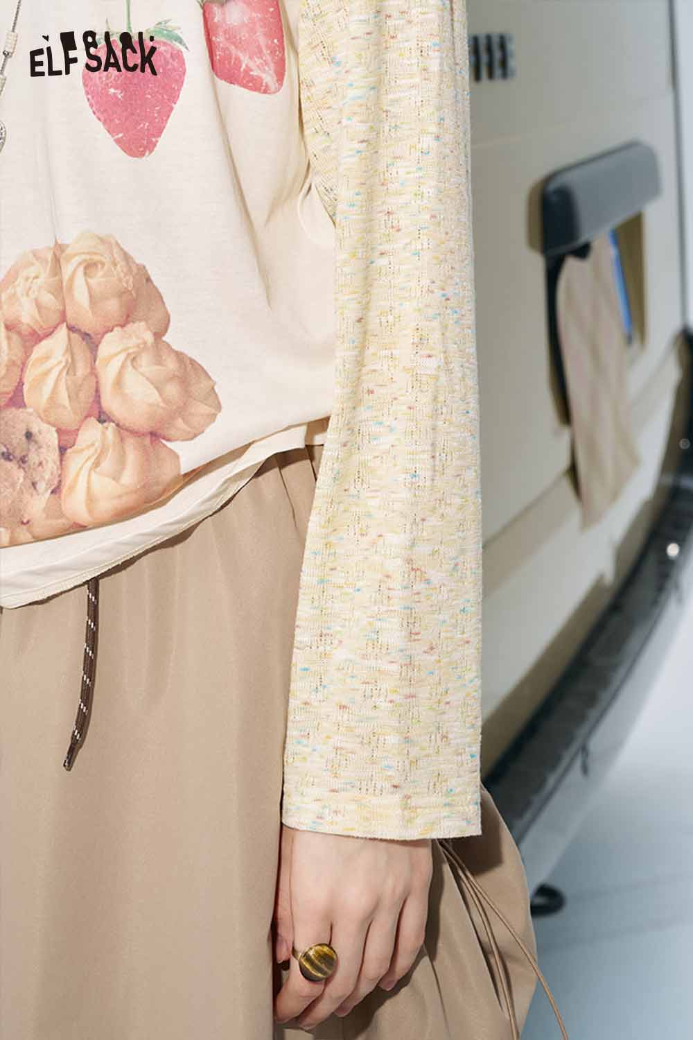 ELFSACK colorblock raglan top for women with floral and strawberry print, speckled cream sleeve, beige skirt