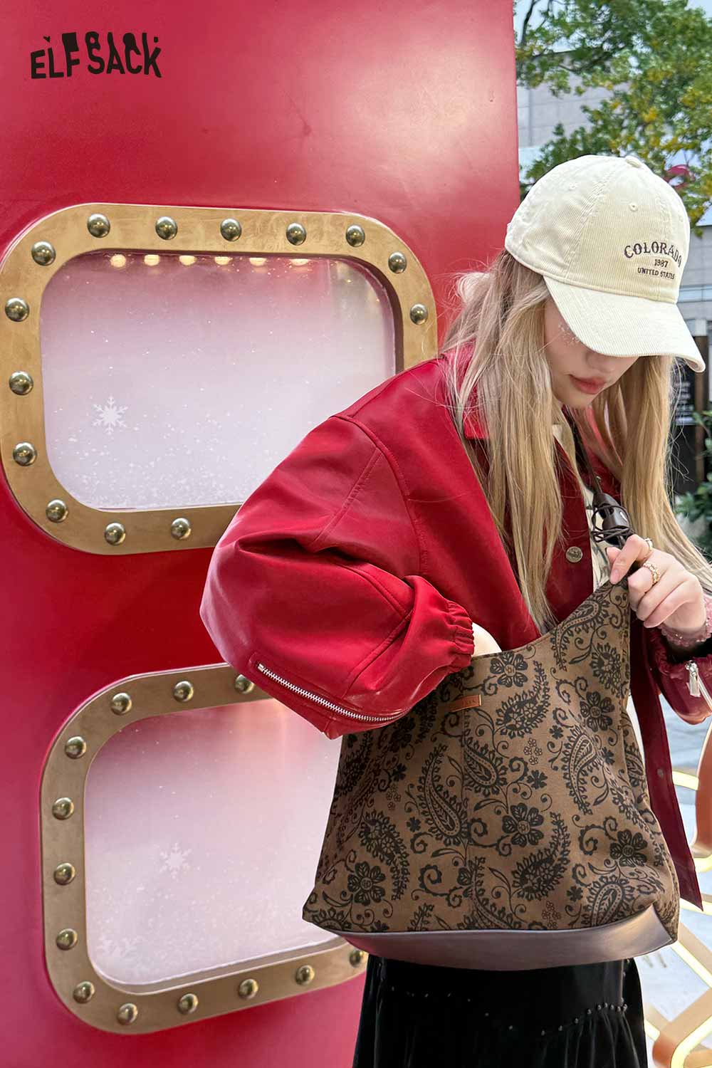 ELFSACK paisley crossbody bag for women styled with a casual outfit in urban setting