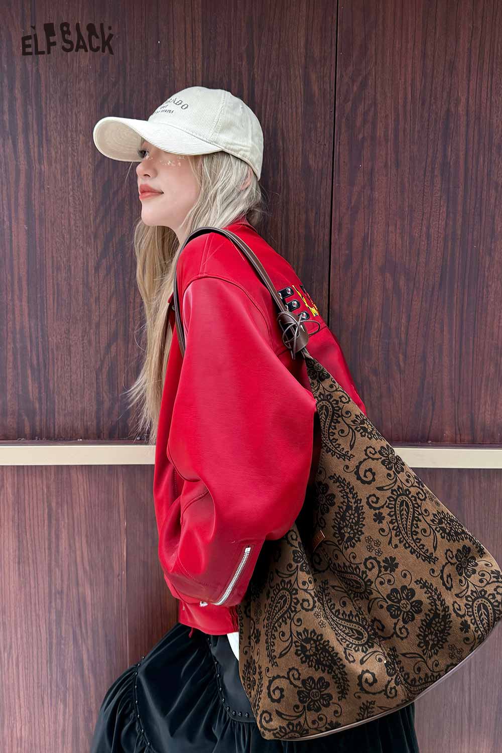 Stylish ELFSACK paisley crossbody bag for women paired with a red sweatshirt and a cap