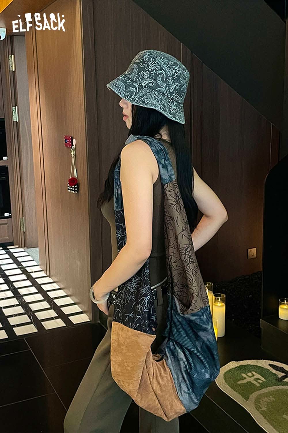 Stylish paisley print bucket hat for women paired with a trendy outfit and slouchy bag