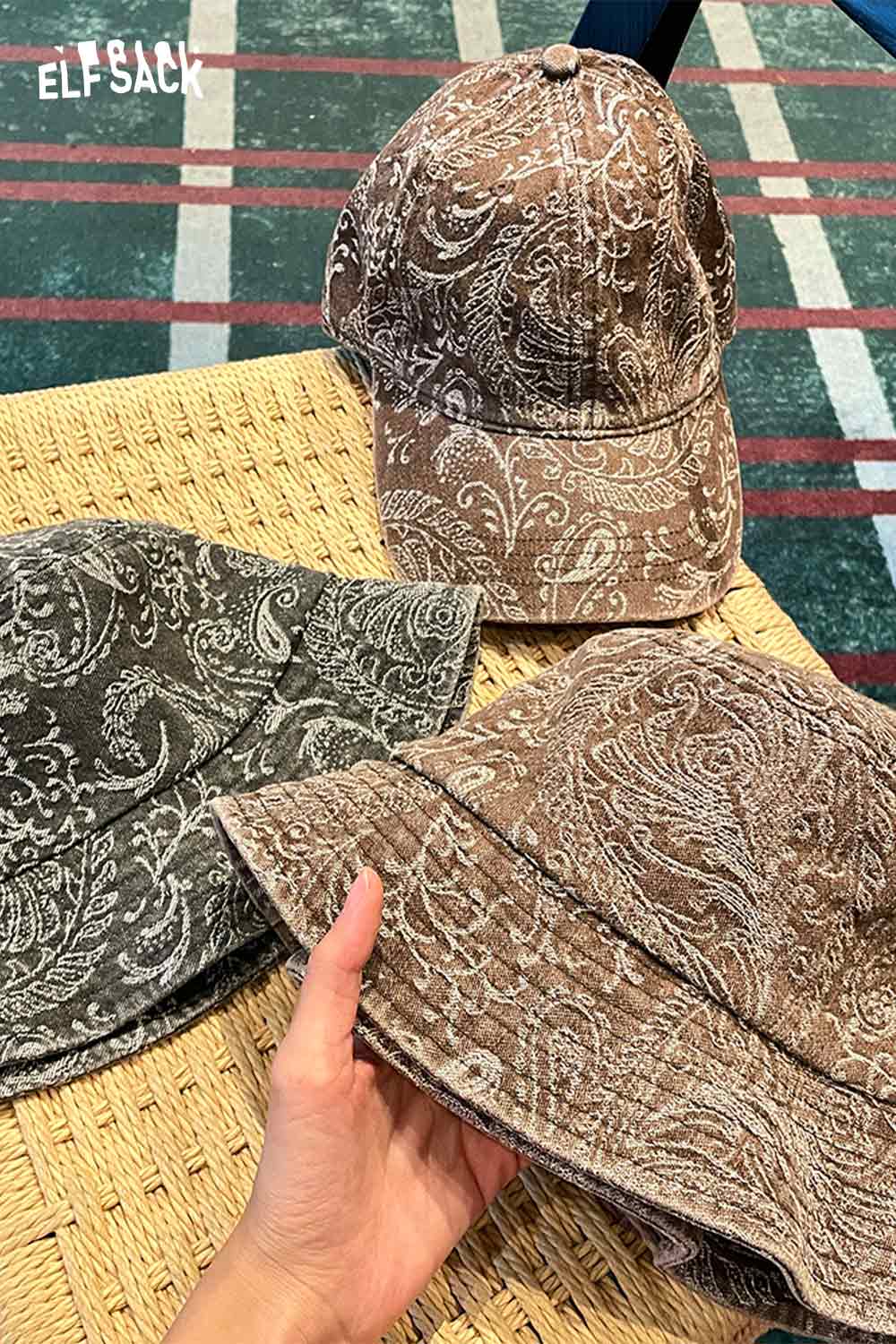ELFSACK paisley print bucket hat for women in brown and gray color options on a woven surface