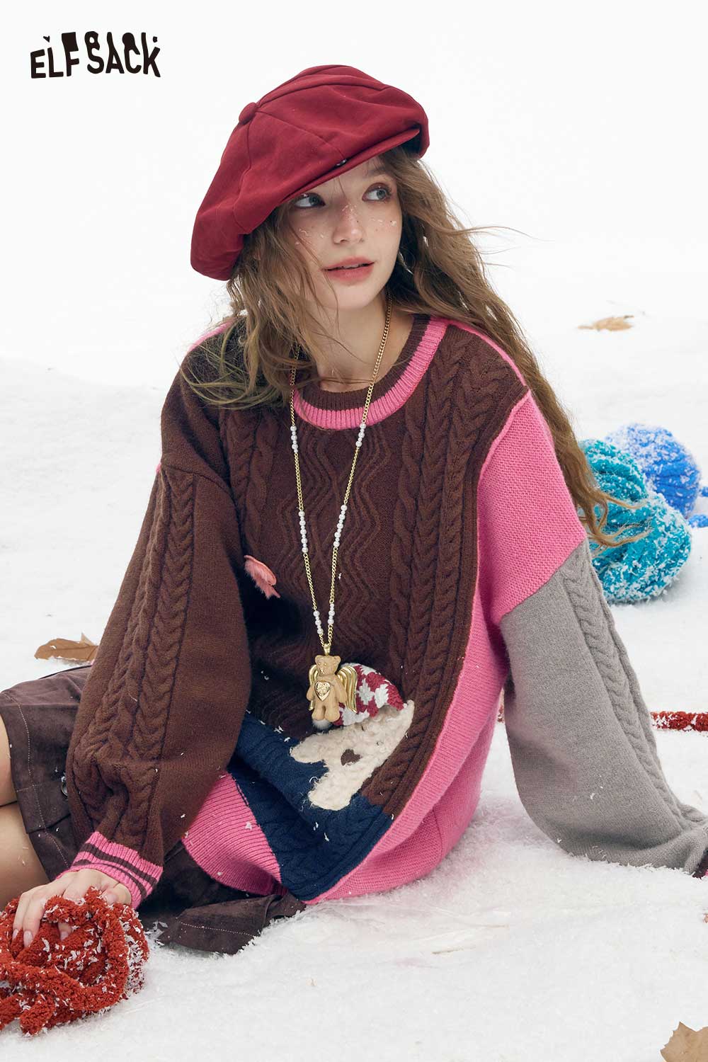 ELFSACK patchwork animal graphic sweater in brown and pink with cable knit details, perfect for winter style