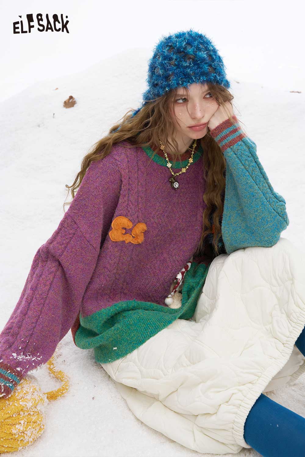 Colorful patchwork animal graphic sweater by ELFSACK featuring unique textures and playful design elements