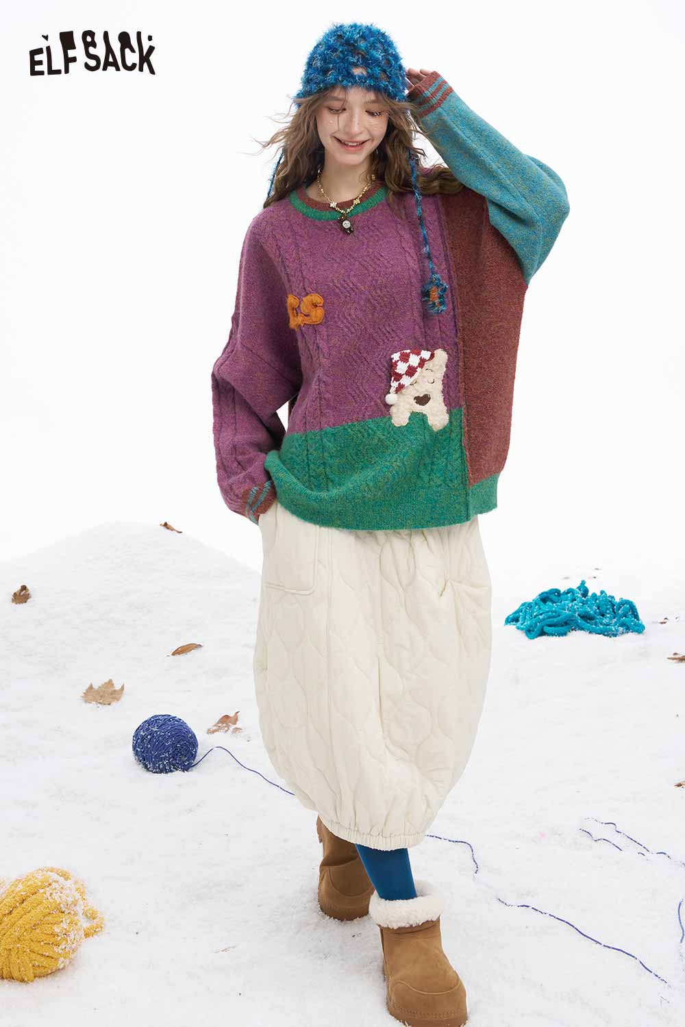 ELFSACK patchwork animal graphic sweater in vibrant colors, styled with a white skirt and winter accessories
