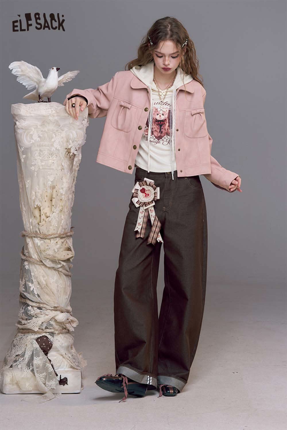 ELFSACK pink faux leather motocross jacket styled with a casual outfit and oversized pants