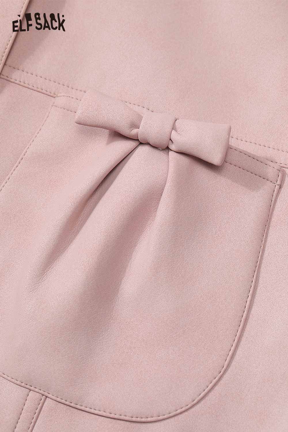 Close-up of ELFSACK pink faux leather motocross jacket with bow detail on pocket