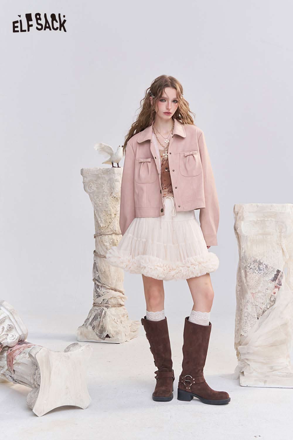 ELFSACK pink faux leather motocross jacket styled with a frilly skirt and knee-high boots