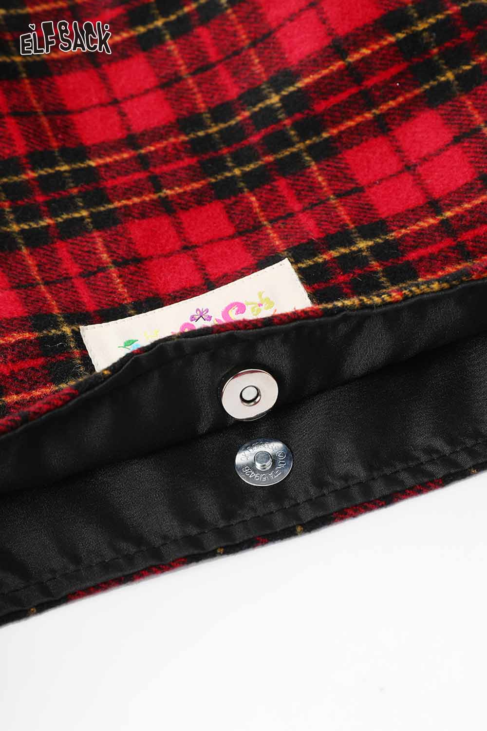 Inside view of the ELFSACK plaid bow crossbody bag featuring a secure snap closure