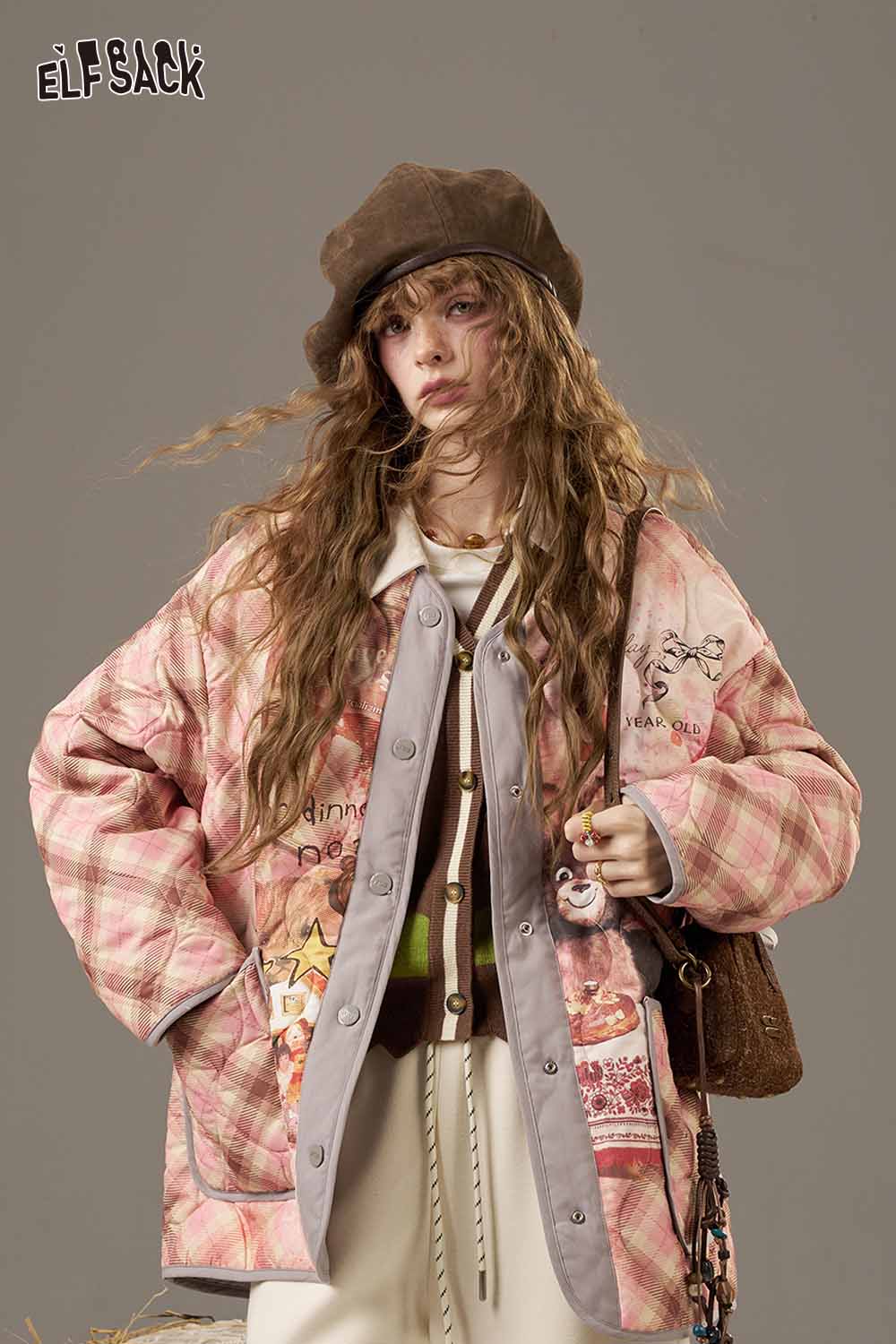 Trendy plaid knit sweater for women styled with a chic oversized jacket and accessories